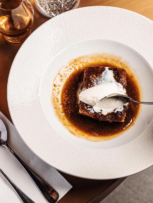 Sticky toffee pudding with butterscotch sauce and Arran vanilla ice cream